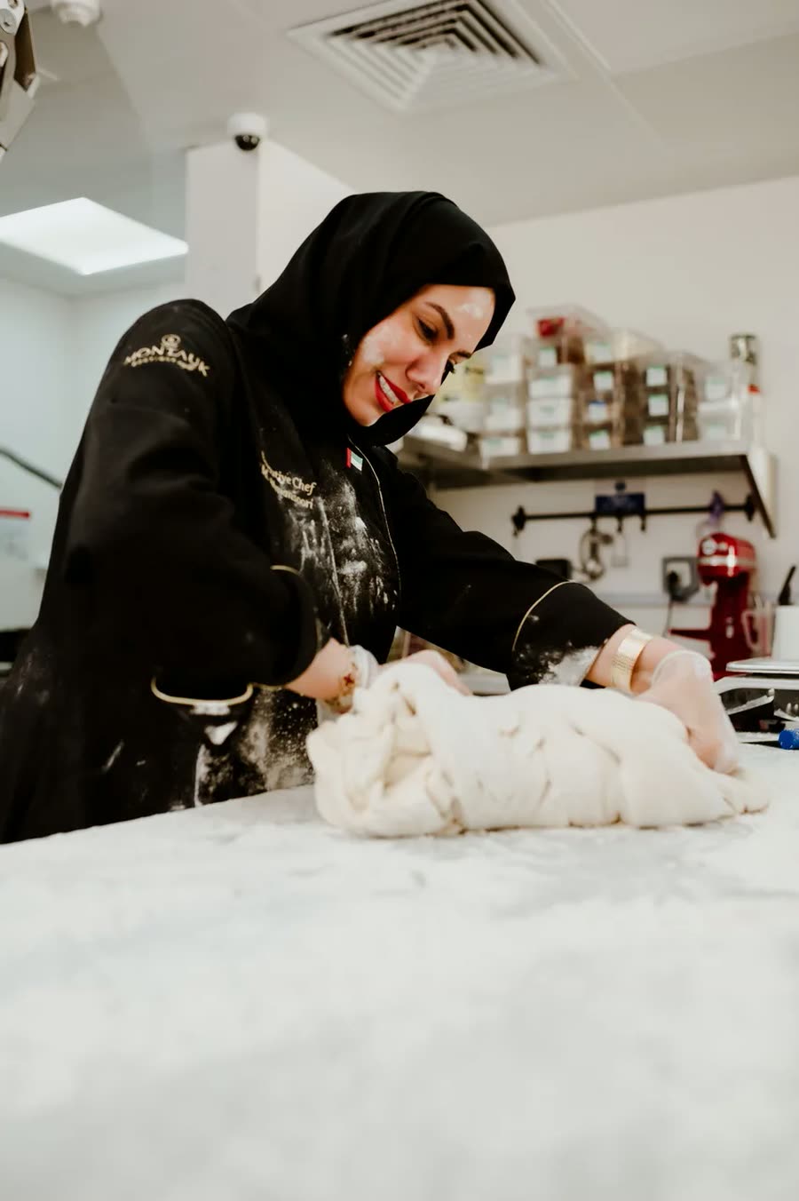 Chef Mariam Almansoori working dough at the academy