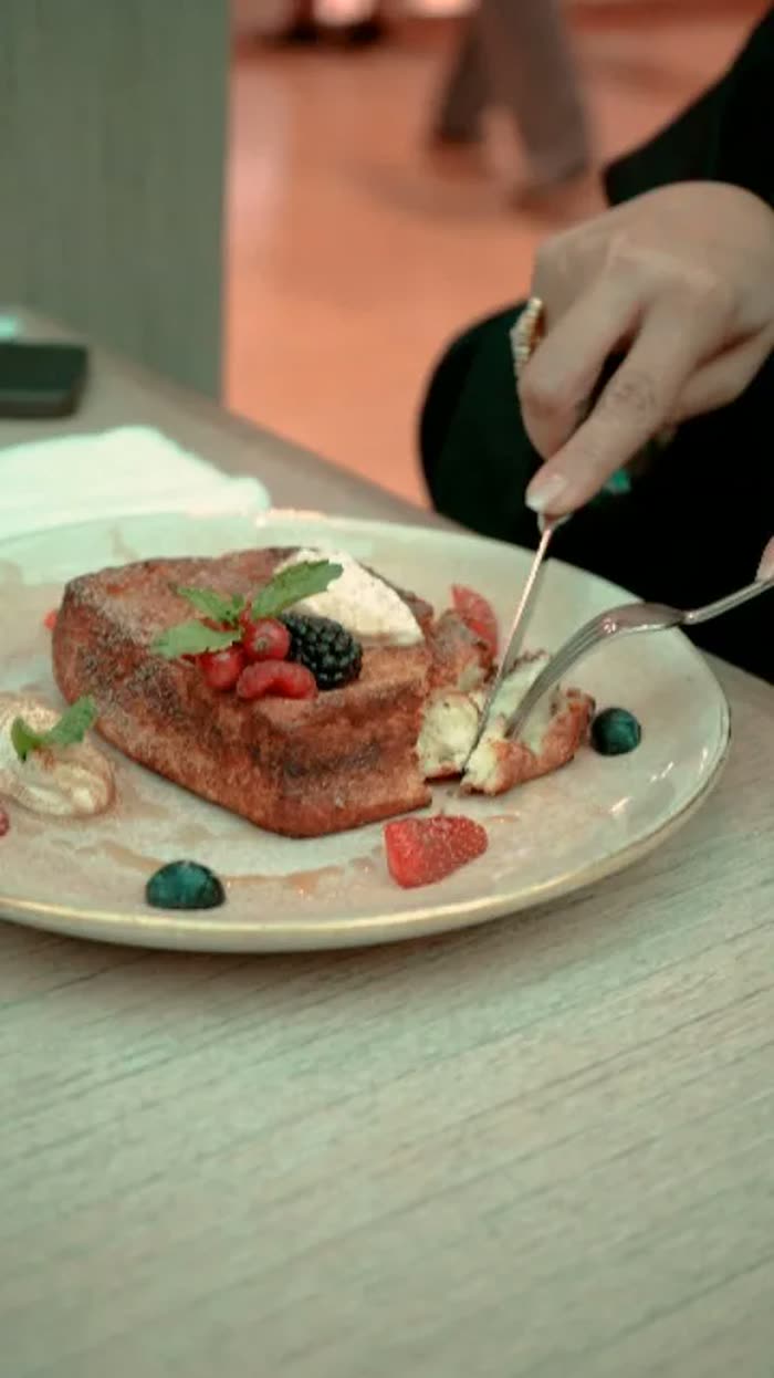 A dessert being finished by hand