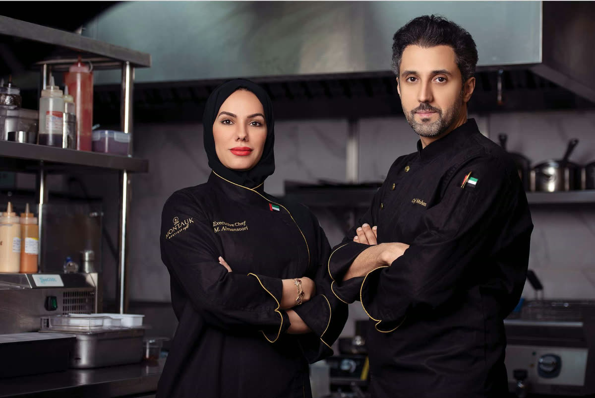 Mohammed Fadhel Al Asfoor with his wife Chef Mariam Almansoori in Montauk chef whites in a working kitchen