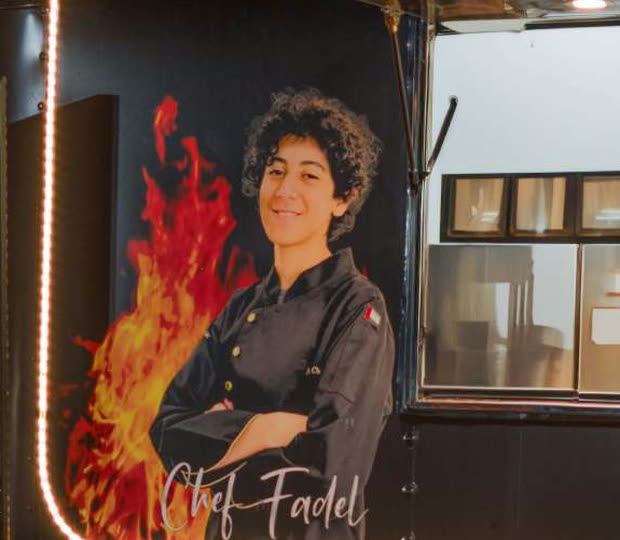 The painted portrait of Chef Fadel on the side of the first MTK Smoke House truck