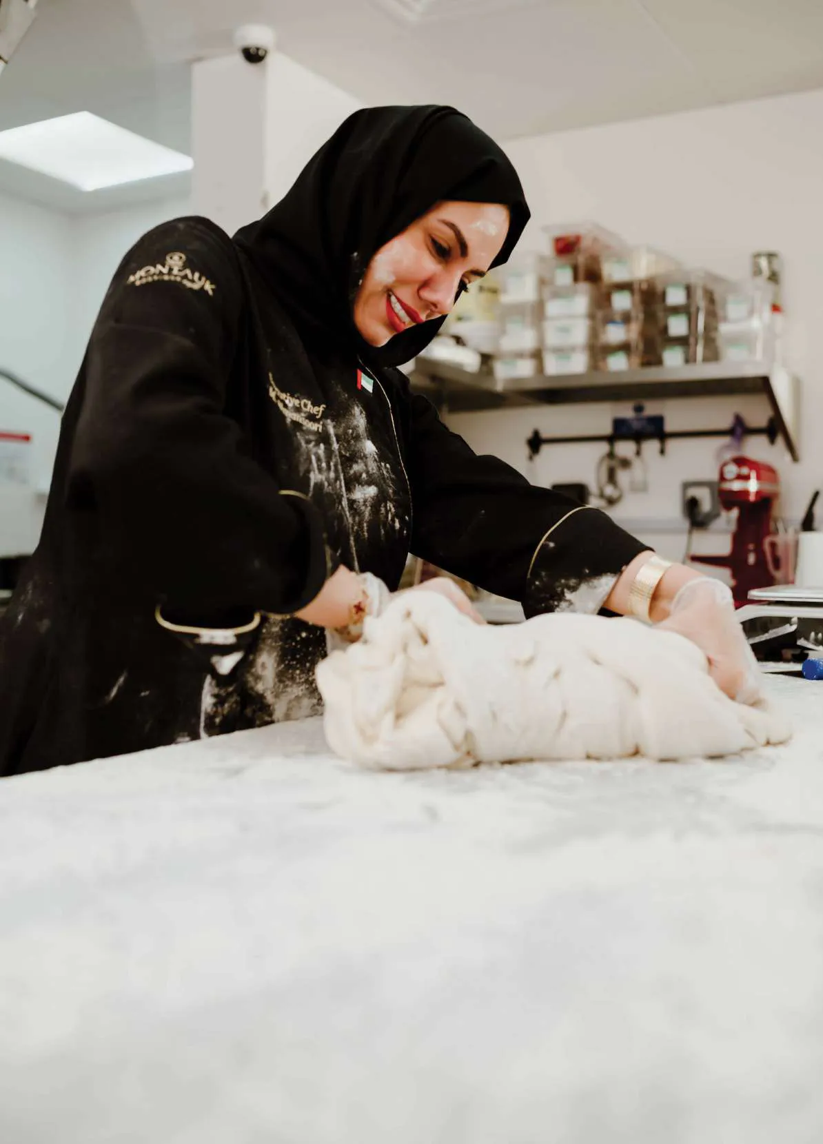 Chef Mariam kneading dough in the bakery