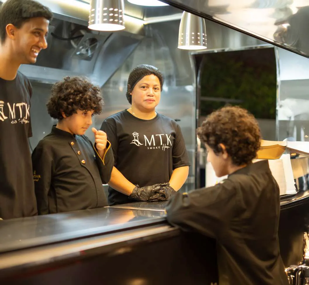 Young guests ordering at the MTK truck window