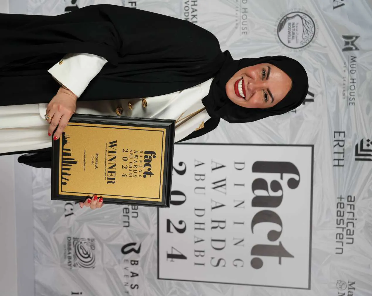 Chef Mariam holding the Fact Dining Awards 2024 winner plaque