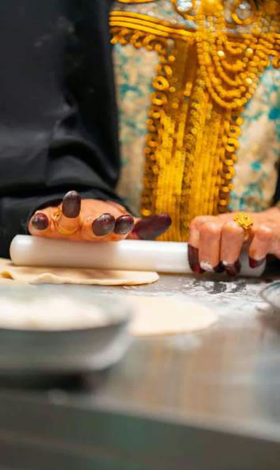 Hands rolling dough in the Montauk kitchen